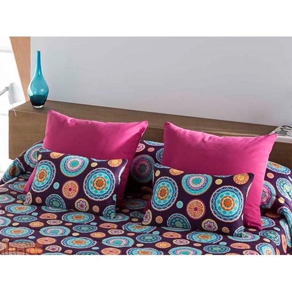 Conjunto de cojines Itaca en color Malva. El estampado con círculos decorados en color morado y el liso en color Fucsia